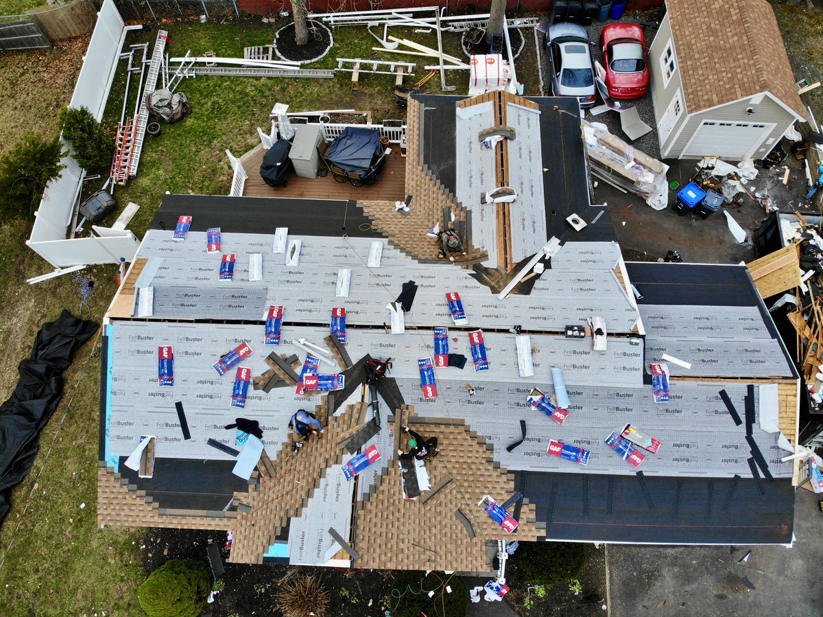 Imperial crew installing GAF architectural shingles during a full roof replacement